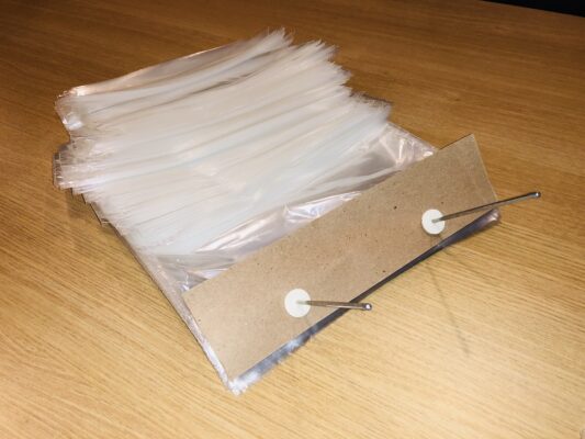 wicketed poly bag sitting on wicket wire